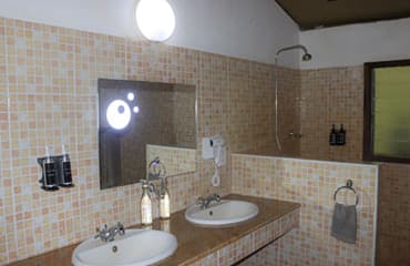 En-suite bathroom with hot-water shower