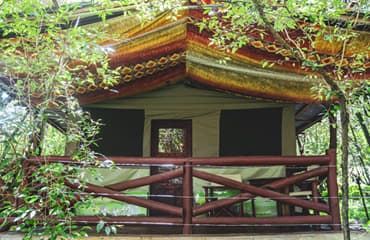 The entrance and private deck of a guest tent